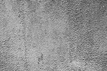 Texture of a concrete wall with cracks and scratches which can be used as a background