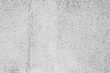 Texture of a concrete wall with cracks and scratches which can be used as a background