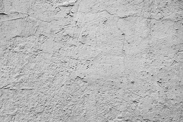 Texture of a concrete wall with cracks and scratches which can be used as a background