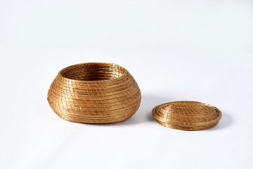 Fototapeta na wymiar handmade basket of typical golden grass from brazil isolated on white background