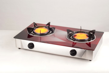 Fototapeta premium kitchen gas stove with burning burners isolated