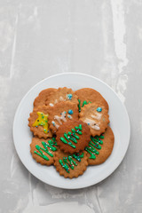 cookies with Christmas decoration on white plate