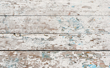 Painted and cracked white paint of the wooden surface for a background