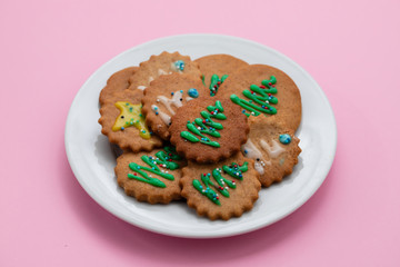 cookies with Christmas decoration on white plate