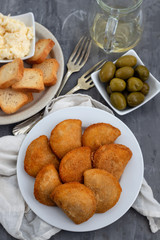 typical portuguese snack with meat rissois de carne on ceramic background