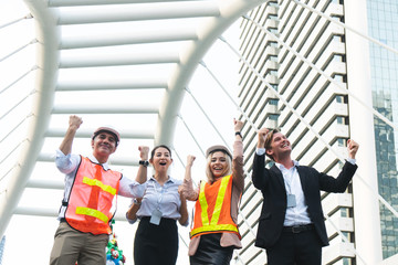 group of business people successful happily standing outdoors, business success.