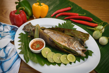Thai style grill fish in banana leave