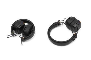 Compact wireless headphones on a white isolated background. Different position of the headphones.