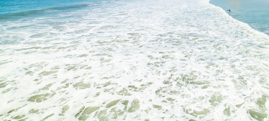 Surfer and wave in Pacific Beach