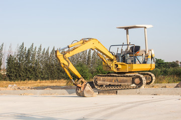 Small crawler Excavator digging bucket on construction of high-speed bypass road to Laemchabang Port.