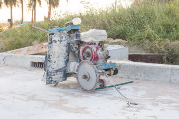 The joint cutter machine on a brushed concrete surface. Construction equipment for cutting saw slab.