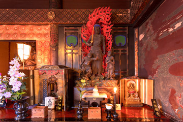 Wood sculpture of buddhist deity Fudou Myoo which is the king of immutable light in the Tendai Buddhism Gokokuin temple of Tokyo.