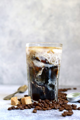 Homemade delicious iced coffee in a tall glass.