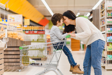 Mother with son at a grocery store