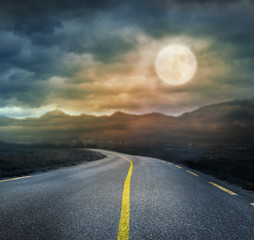 night scary landscape with road and full moon