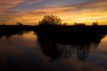 Fototapeta na wymiar Aerial: dramatic sunrise above the river