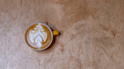 Shot from above for a cup of coffee with latte art