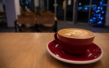 Shot of a countertop with a coffee cup on the background of a cafe or restaurant.