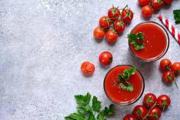 Fototapeta na wymiar Fresh tomato juice. Top view with copy space.