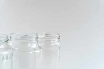 Glass jars at gray monochrome background. Zero waste concept.