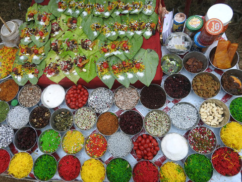 Banarasi paan or betel leaf garnished with betel nut and all indian colorful banarasi ingredients for sale