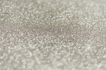Silver background Abstract Bokeh Christmas. Shiny silver glitter background with copy space