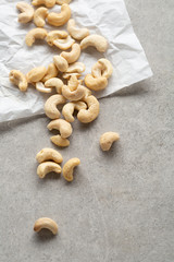 Cashew nuts on white paper