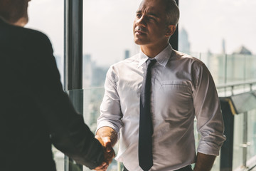Business partnership successful meeting concept. Image businessman handshake. Business etiquette. Successful businessman handshaking after good deal.