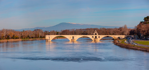 Pont Saint Benezet bridge on the Rhone River  and  Palace of the Popes ( Palais des Papes) and...