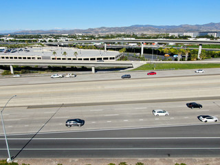 Aerial view of highway transportation with small traffic, highway interchange and junction, San Diego Freeway and Santa Ana Freeway. USU California