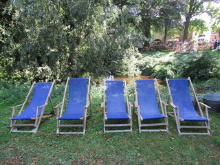 five blue chairs in the garden