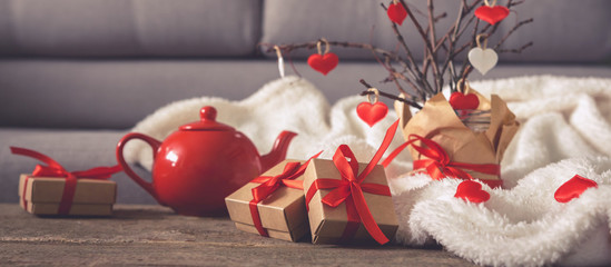 Valentine's day, wedding zero waste, eco-friendly gift wrapping kraft paper and branches with hearts, gift basket, cozy winter winter evening eco concept eco-friendly banner decor