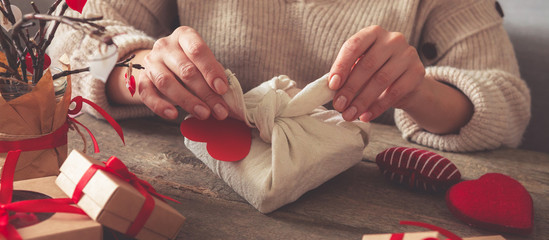 Valentine's day, wedding zero waste, eco-friendly gift wrapping kraft paper and branches with...