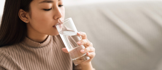 Healthy Liquid. Asian Girl Drinking Clean Water From Glass