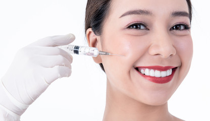 Close up images of Asian young pretty woman, smiling, beautiful white and clean teeth And syringe...