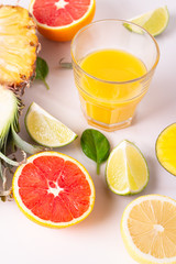 fruit juice in a glass and fruits