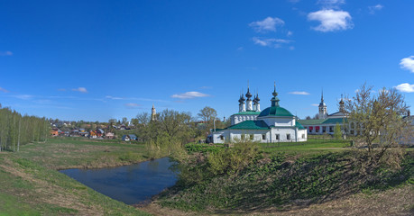 Spring sunny day. View of the old Russian city from the Kremlin ramparts. The Golden Ring of Russia, Suzdal.