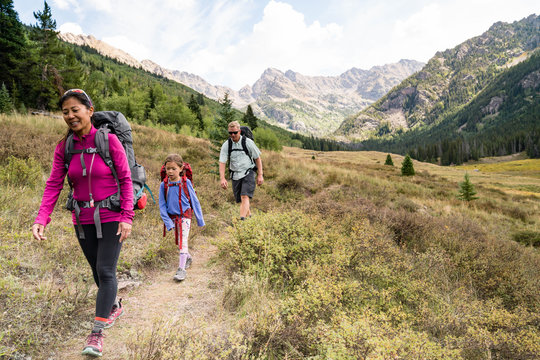 Familiy of four, with two young children, backpacking outside of Vail Colorado on the Upper Piney River Trail.