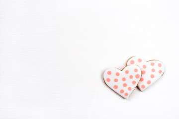 Gingerbread cookies with frosting in the shape of a heart. Valentines day concept. Flat lay, top view, copy space for text.