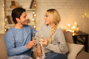 Happy valentine's day! Happy couple drinking champagne