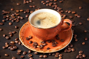 Ceramic cup of coffee on dark table