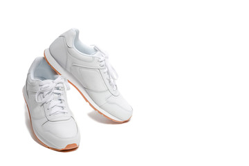 Pair of New White Modern Trainers Placed over Over White Background.