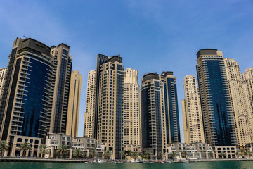 Obraz na płótnie Canvas Dubai Marina looking up at the tall buildings