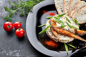 Forshmak on a black plate