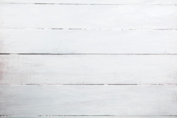 White wood panel made of boards arranged horizontally.