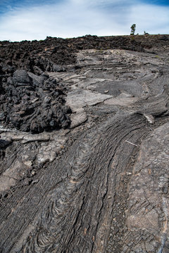 picture of a cooled lava flow showing different textures