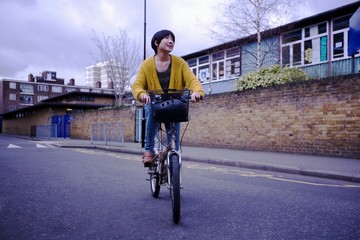 Woman Riding Cycle On Street