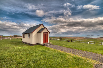 Fototapeta na wymiar The church of Berunes, Djúpavogi. The picturesque town of Berunes, Djúpavogi. Iceland