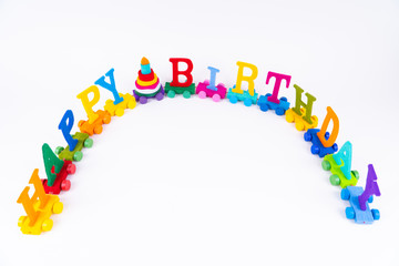 A train with the word "Happy Birthday" and a birthday cake on white background