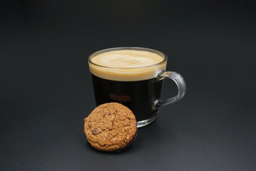 Cup of coffee and chocolate chip cookies.